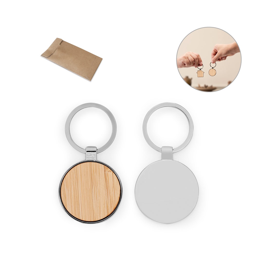 GASTON ROUND. Round-shaped iron keychain made of zinc and bamboo.